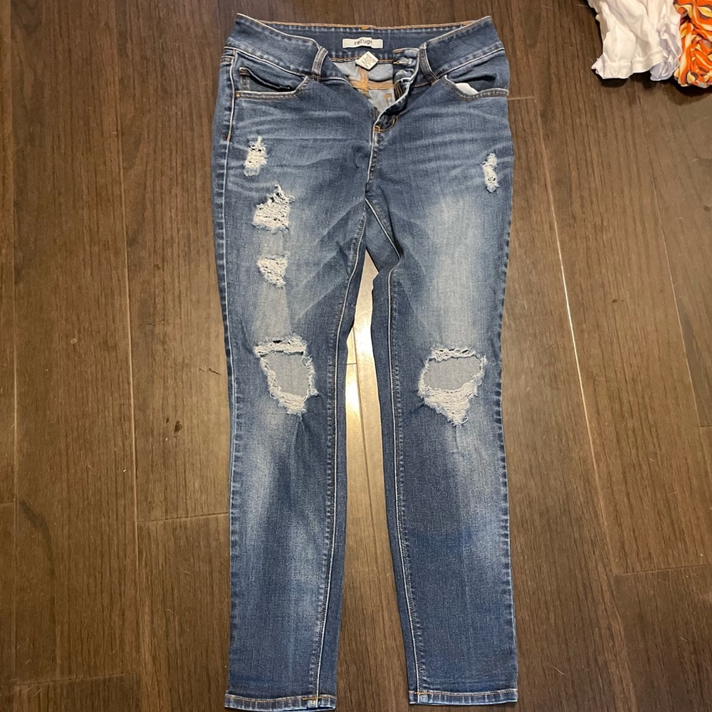 Distressed blue jeans